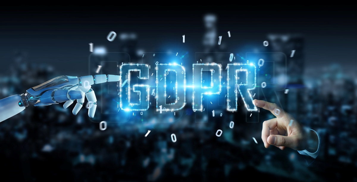 Robot hånd og menneskelig hånd peker mot opplyst skrift GDPR. Foto.